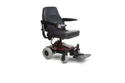 Senior using Shoprider Jimmie power chair inside the home